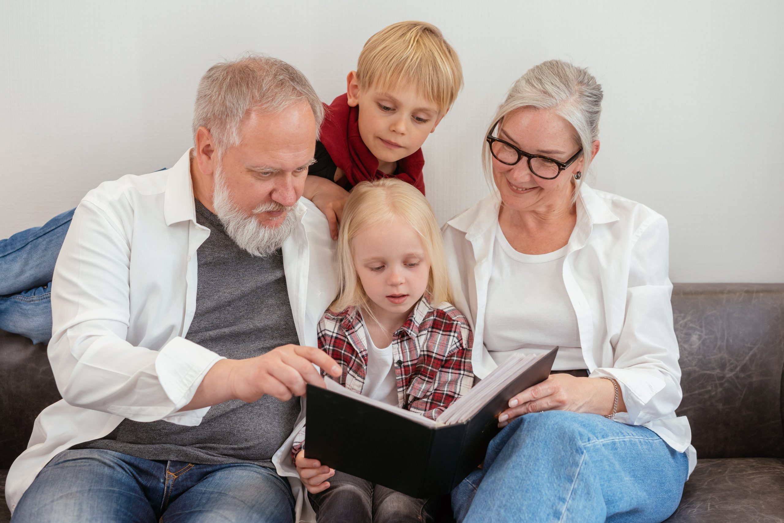 Grandparents reading to their grandchildren.